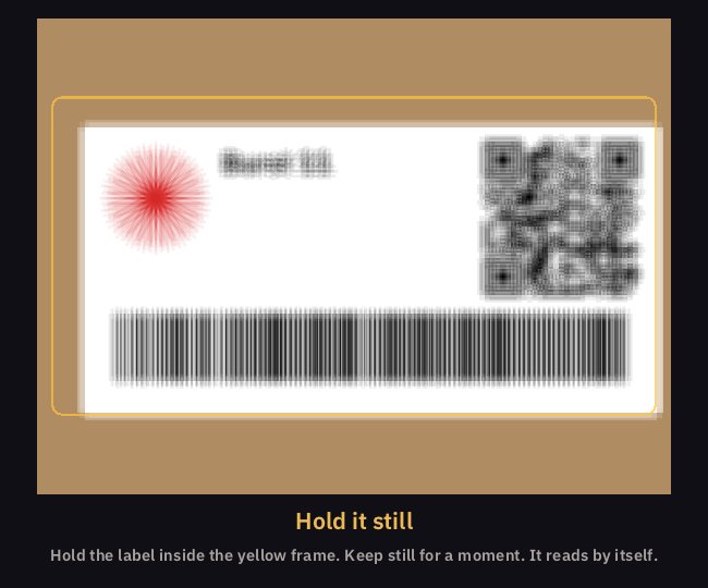 The viewfinder on the label of the box Burst 11, still shaking and blurred, under the words Hold it still
